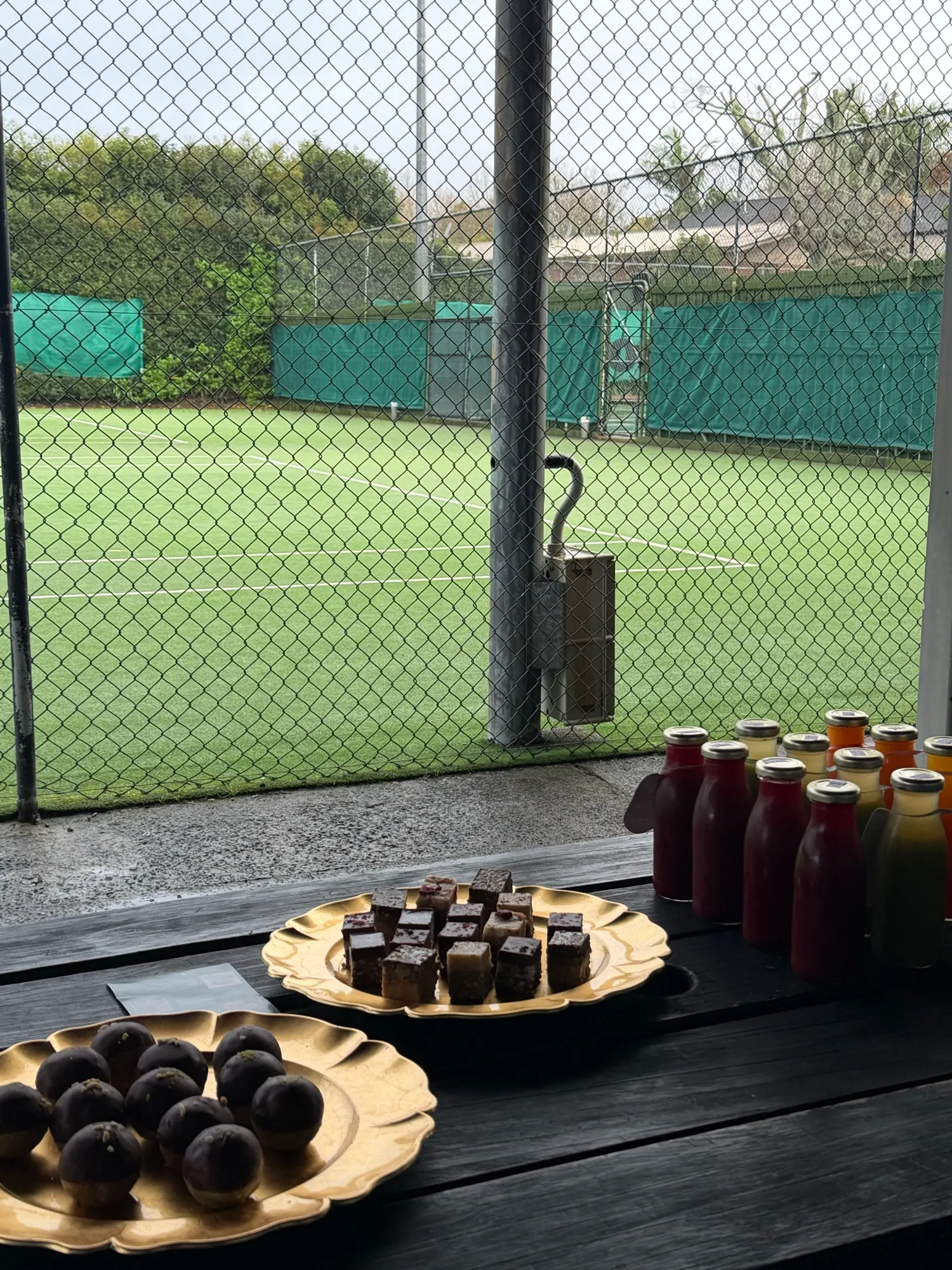 Bliss balls, brownies and fresh juices laid out on the table at O-Social